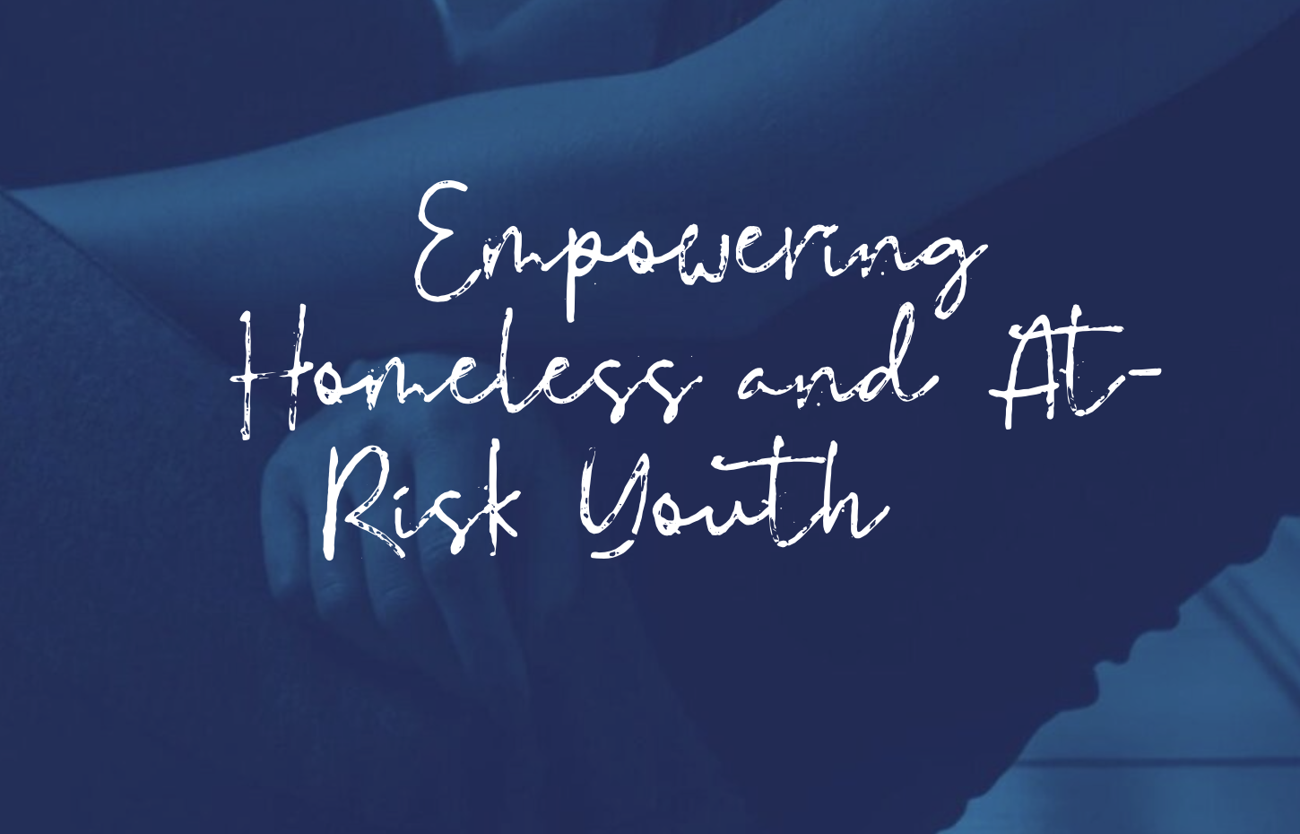 White letters on blue background: Empowering Homeless and at risk Youth.